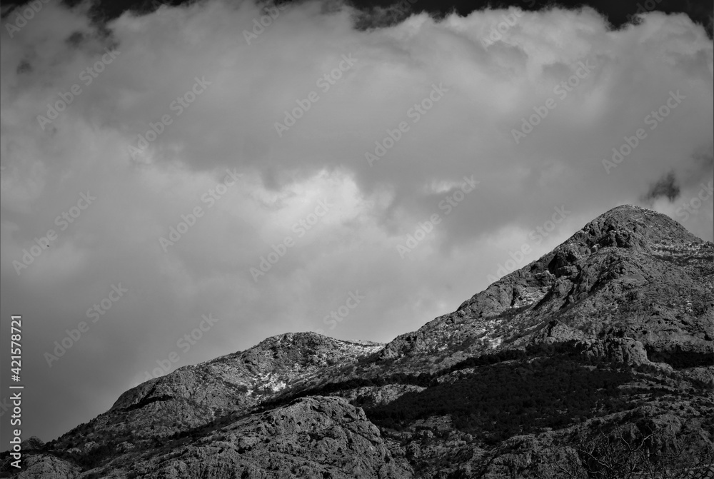 Mountain with big white clouds black and white Mountain with big white clouds black and white