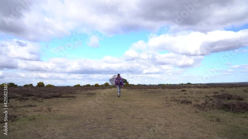 Woman walking in forest