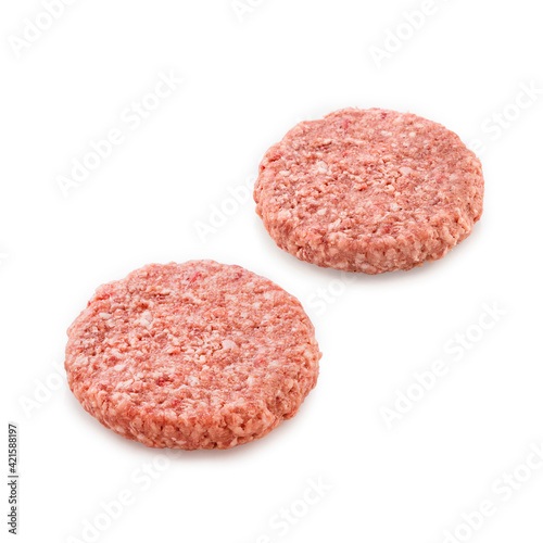 Raw burger patties on white background