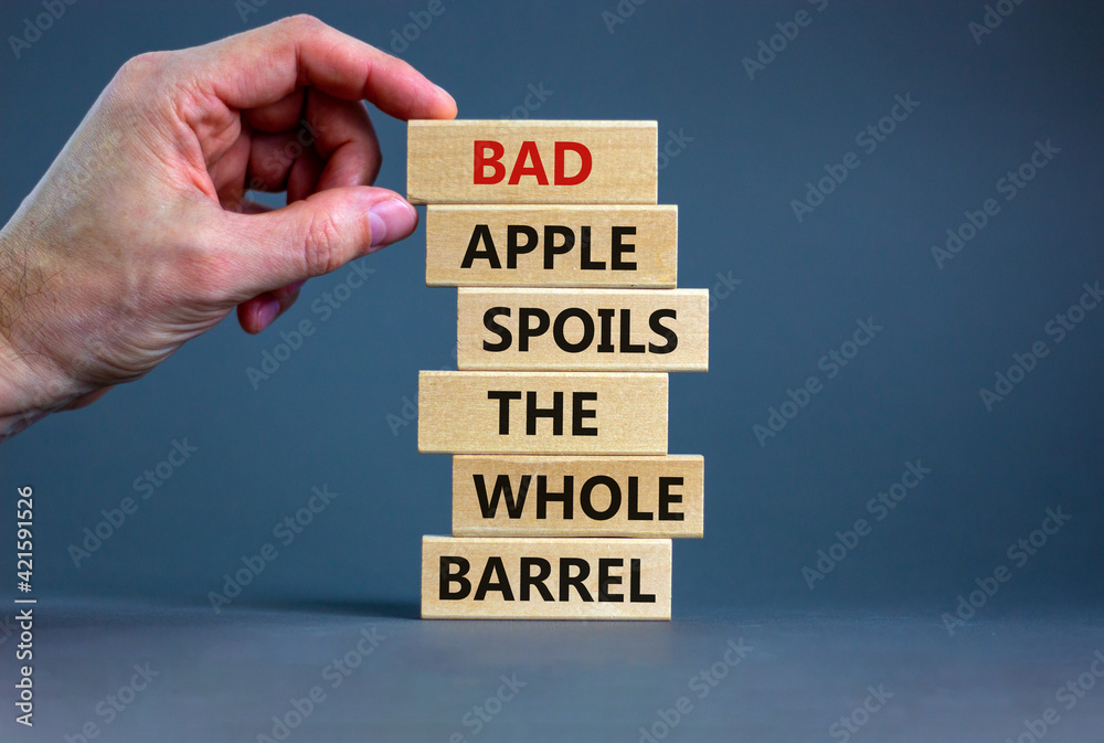 Foto de Bad apple spoils the whole barrel symbol. Wooden blocks with ...