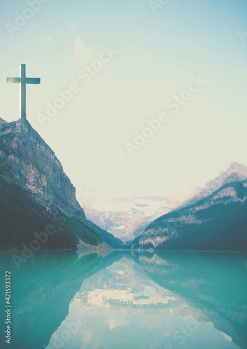 Background for lent season. Cross in the mountains