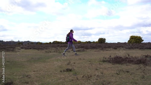 Woman walking in forest