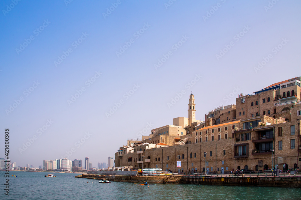 Tel Aviv-Jaffo, Israel - March 15, 2021: Panoramic view of Jaffa's ancient port. Located to the south and known as an ancient port city. View of the St. Peter's Church. Jaffa is part of Tel Aviv