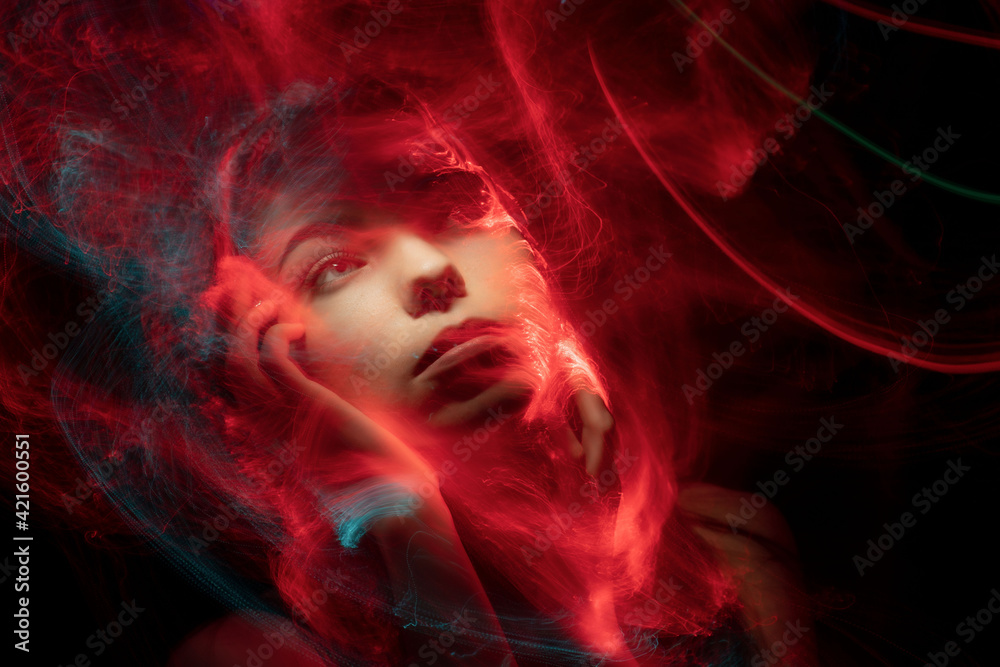 Portrait of Beautiful Woman. Girl with Art Make-Up in Color Light. Fashion Model with Colorful light Makeup Portrait of Beautiful Woman. Girl with Art Make-Up in Color Light. Fashion Model with Colorful light Makeup