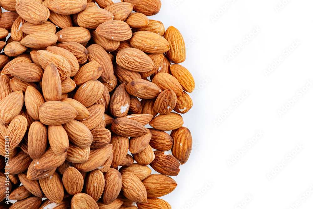 Almond Nuts Isolated On White Background Close Up. Pile Almond on white background. Heap of almond isolated on white. Almond Nuts Isolated On White Background Close Up. Pile Almond on white background. Heap of almond isolated on white.