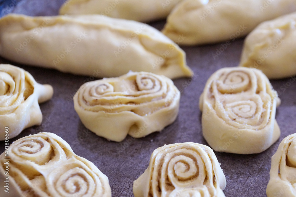 sweet pastries on a baking sheet cooked for baking food background