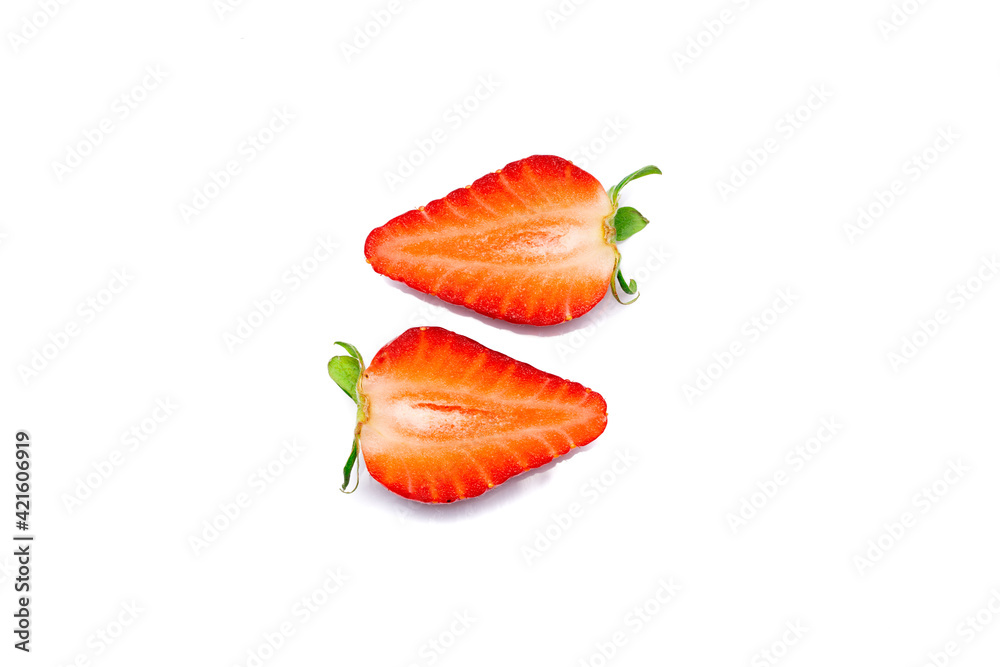Cut ripe strawberry on white background