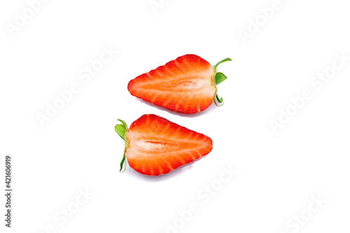 Cut ripe strawberry on white background