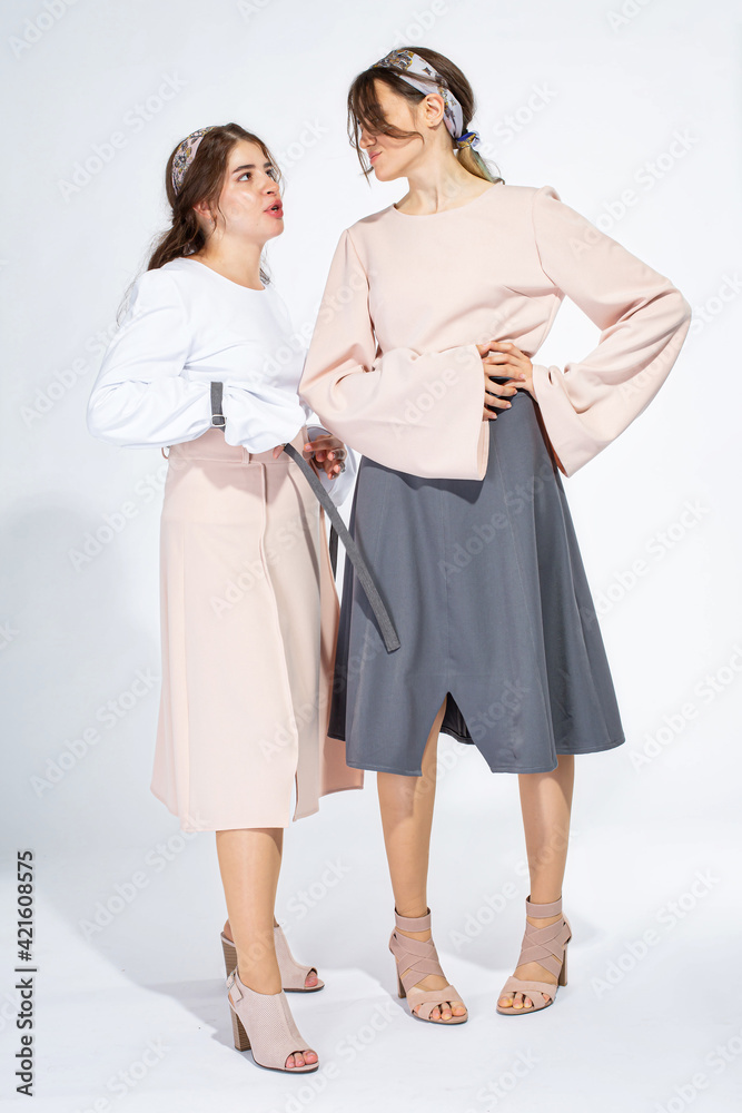 Young white girls isolated on light grey Young white girls isolated on light grey