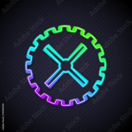 Glowing neon line Bicycle sprocket crank icon isolated on black background. Vector