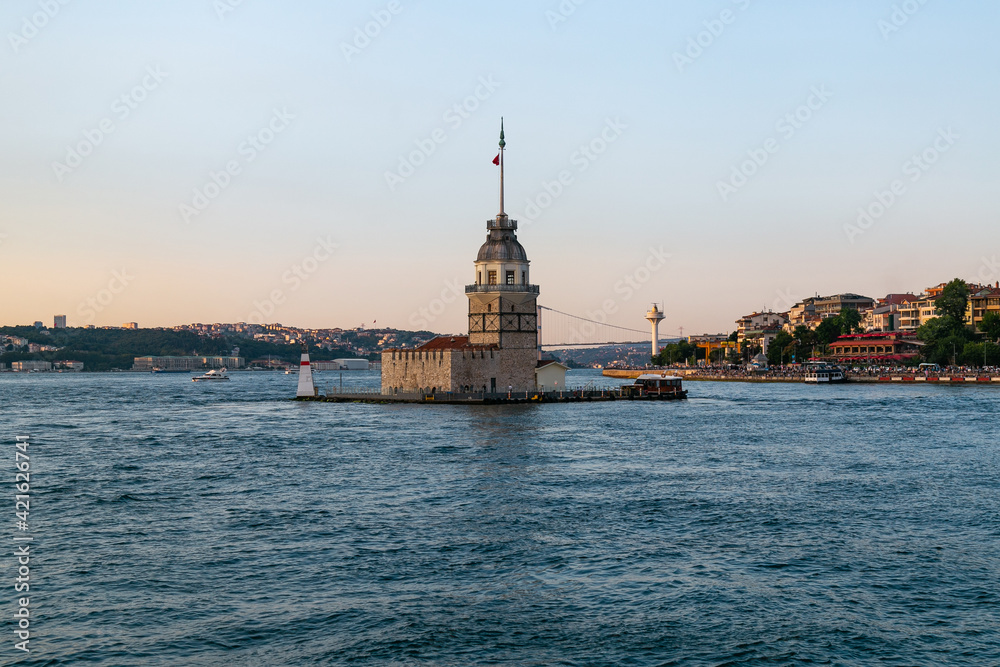 Maiden Tower, Kiz Kulesi on the Asian side of Istanbul at sunset in the middle of Bosphorus, Turkey. One of the symbols of Istanbul. Ancient lighthouse of the Ottoman period. Girl tower. 