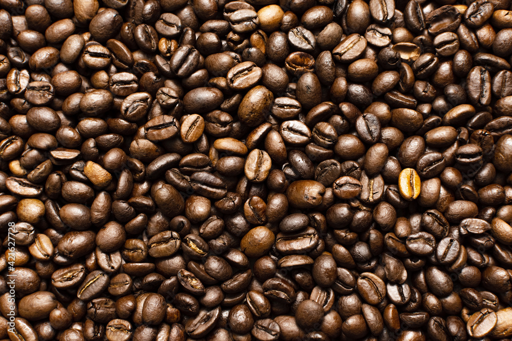 Coffee beans. Coffee beans are spread out on the surface. Coffee beans. Coffee beans are spread out on the surface.