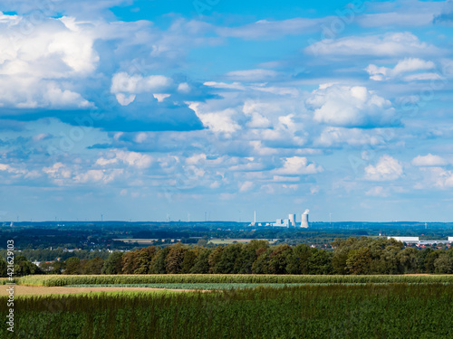 sky with clouds outside the city, on the horizon thermal power plant