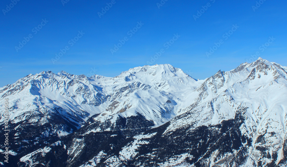 Panoramic view of snowy mountain peaks in the Savoy Alps.