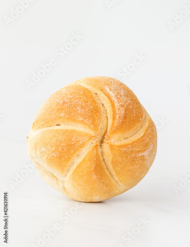 fresh baked bun (roll) on a white