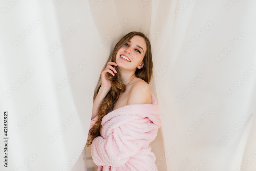 Happy rich young woman wear night robe in modern home hotel, good morning lifestyle concept Happy rich young woman wear night robe in modern home hotel, good morning lifestyle concept