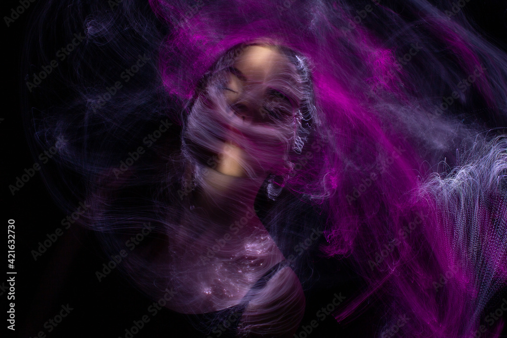 beautiful girl model with cosmic make-up on face, blue and purple color on dark background , longexposure foto beautiful girl model with cosmic make-up on face, blue and purple color on dark background , longexposure foto