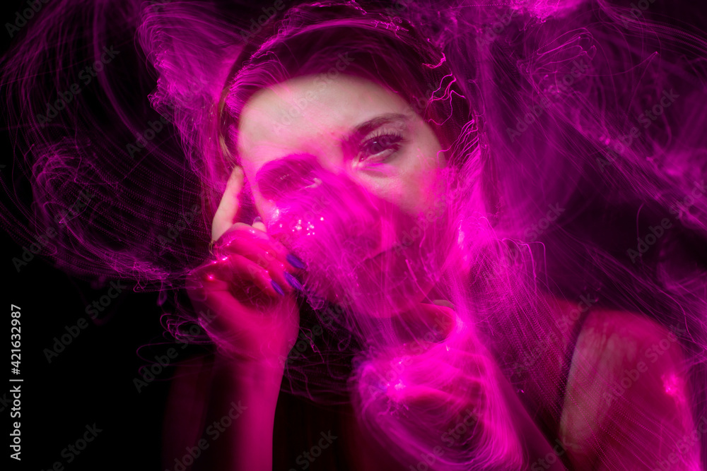 beautiful girl model with cosmic make-up on face, blue and purple color on dark background , longexposure foto beautiful girl model with cosmic make-up on face, blue and purple color on dark background , longexposure foto