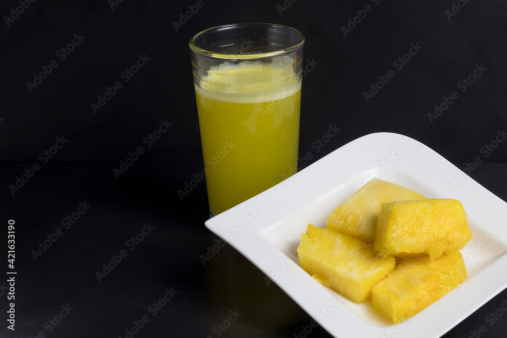 Pineapple fruit juice concept isolated on black background Pineapple fruit juice concept isolated on black background