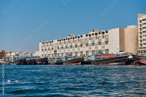 Dubai creek and water traffic there: cargo ships, touristic boats and docked ships © dimo