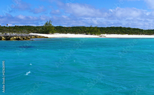 Clear blue waters of Exuma Cays with white-sand beaches, Bahamas. © raksyBH