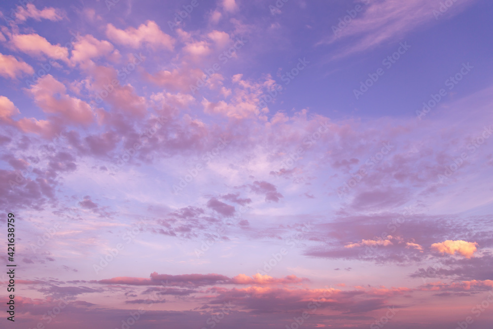 Dramatic sunrise, sunset pink violet blue sky with fluffy clouds abstract background texture Dramatic sunrise, sunset pink violet blue sky with fluffy clouds abstract background texture