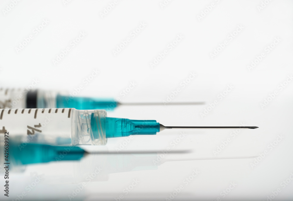 Studio shot of syringes with needles Studio shot of syringes with needles