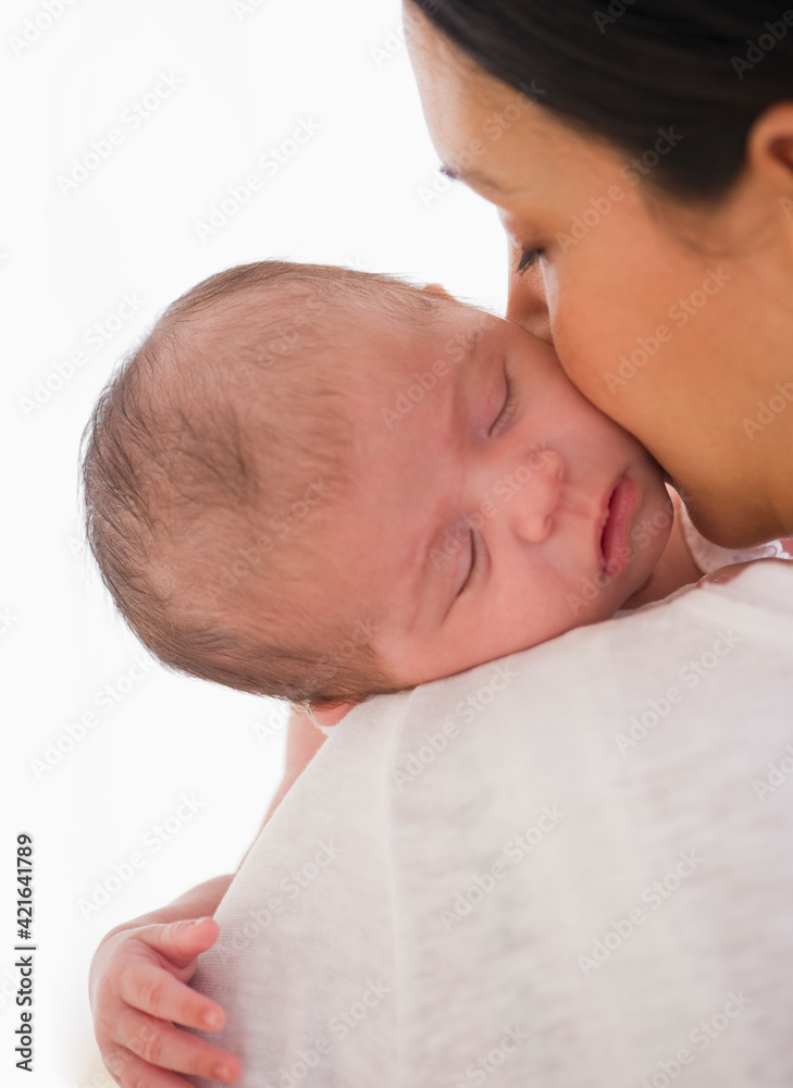 Baby sleeping on mother's shoulder Baby sleeping on mother's shoulder