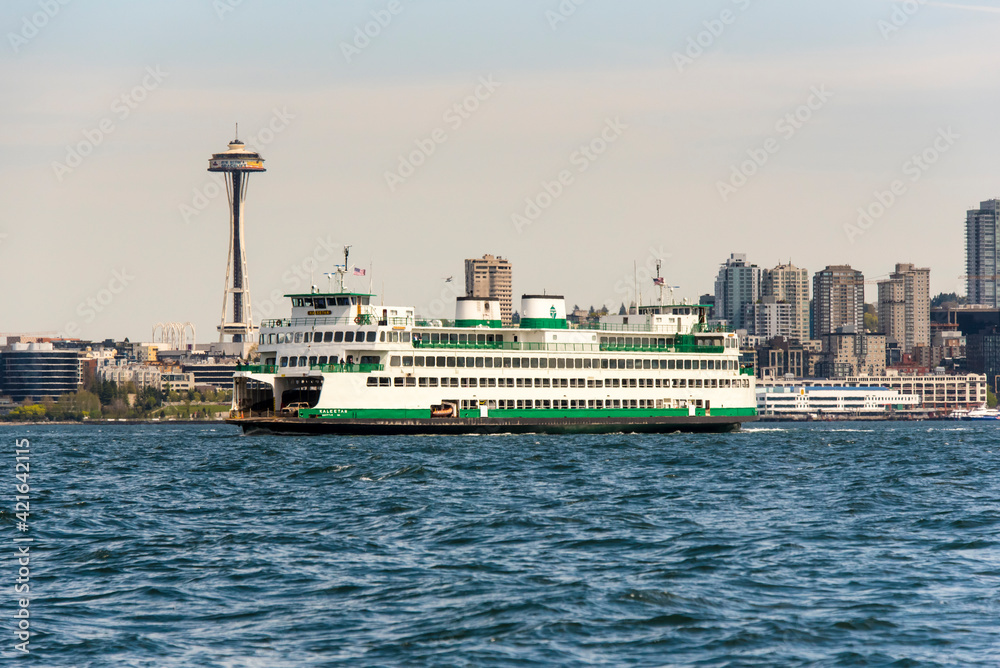 USA, Washington State, Puget Sound. Washington State ferry in Elliott Bay. Space Needle in renovation. Waterfront and skyline