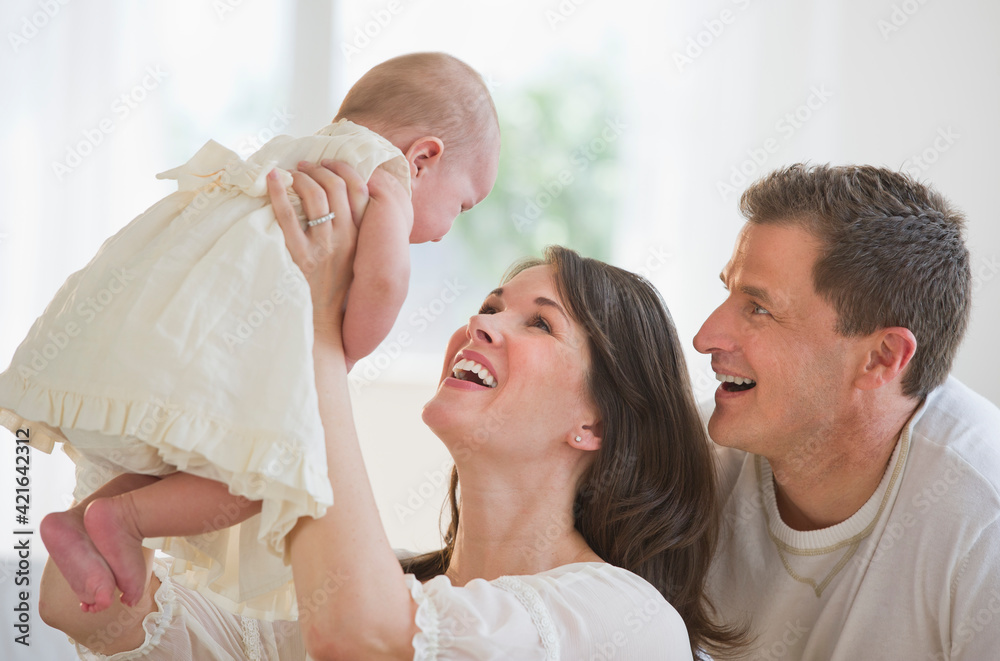 Proud parents and their baby daughter Proud parents and their baby daughter