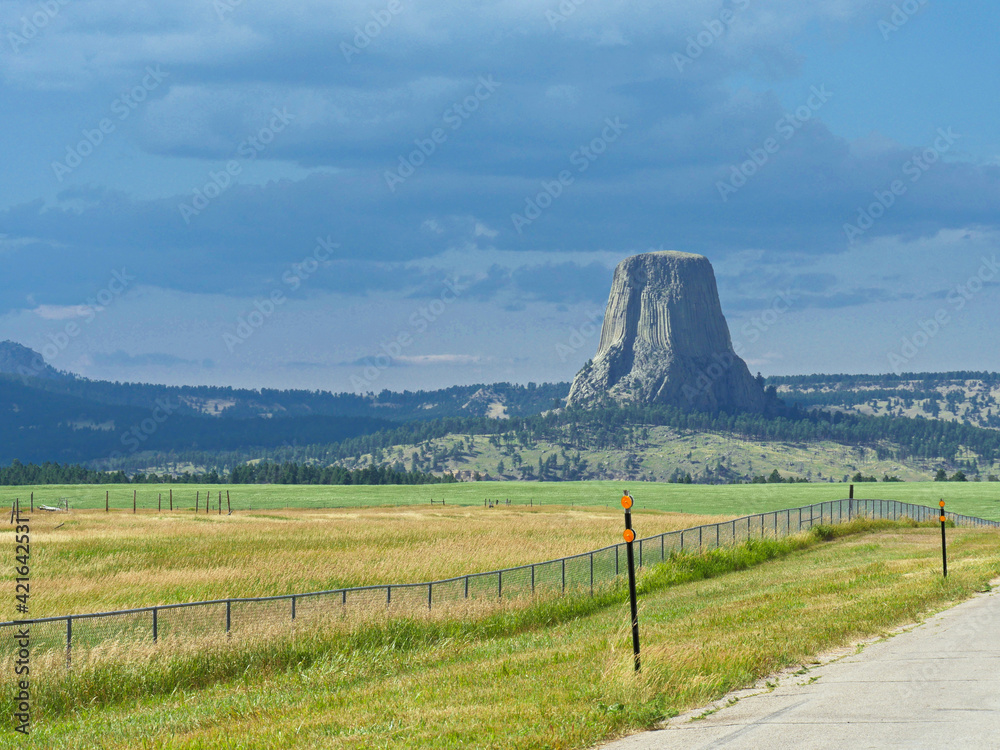 The famous Devils Tower seen from the road at a distance in Wyoming.