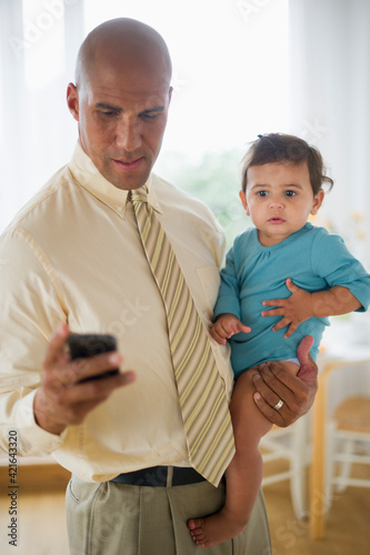 Father with small girl (12-18 months) photo