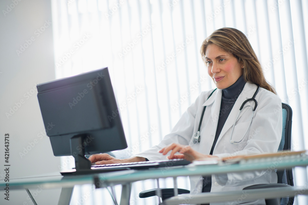 USA, New Jersey, Jersey City, Female doctor using computer in office USA, New Jersey, Jersey City, Female doctor using computer in office