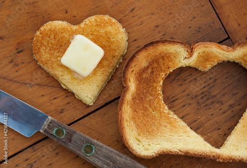 Heart shaped toast on table photo