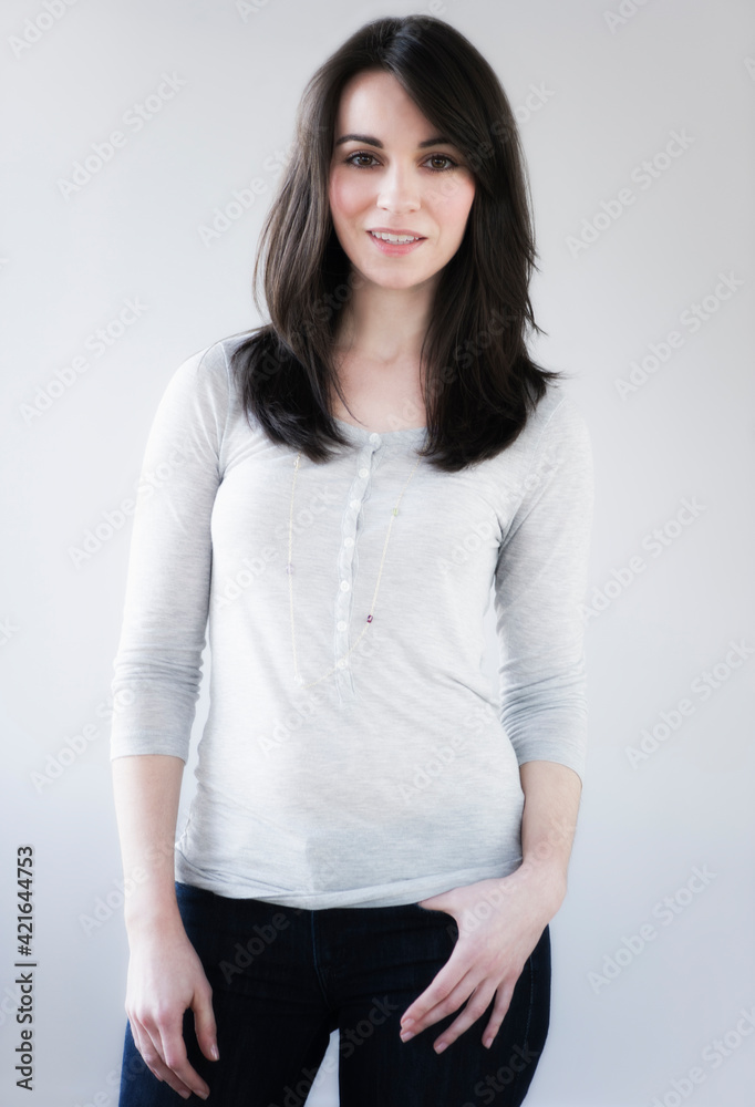Studio portrait of young woman smiling Studio portrait of young woman smiling