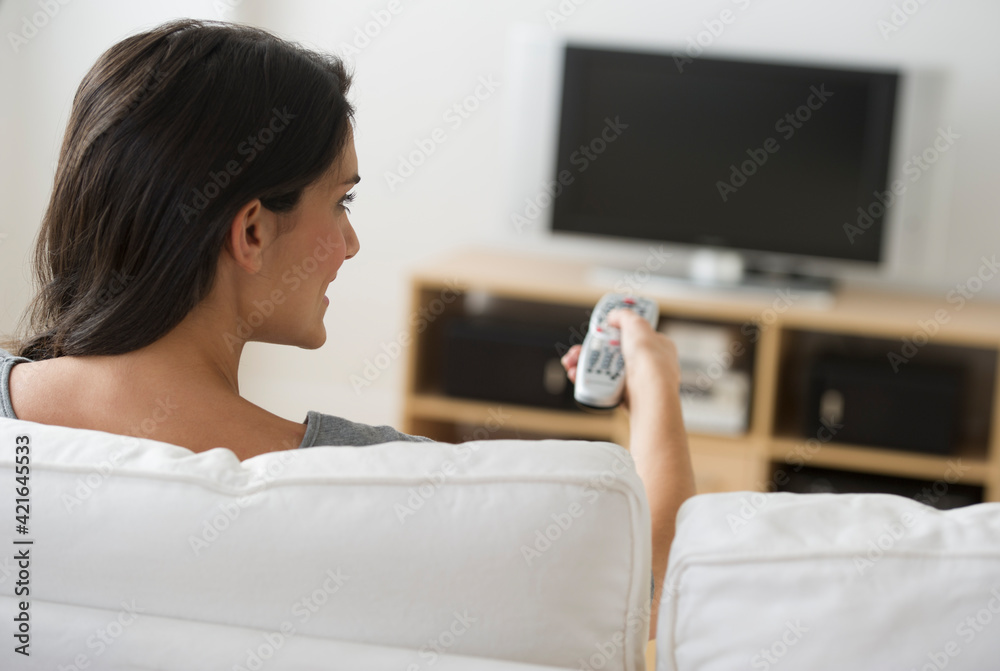 Woman watching tv Woman watching tv