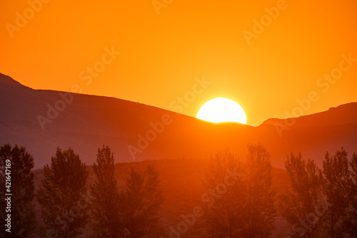 USA, Idaho, Bellevue, Sun rising behind mountain