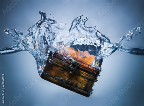 Treasure chest sinking in water
