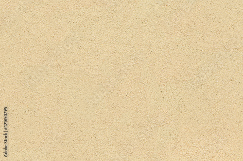 Sand background. Natural light beige or white sandy beach texture.
