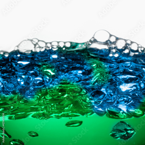 Close up of blue  and green water surface with bubbles