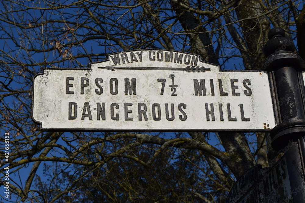 Old fashioned vintage roadsign danger warning for dangerous hill, Epsom, UK