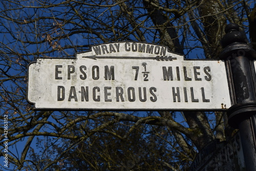 Old fashioned vintage roadsign danger warning for dangerous hill, Epsom, UK