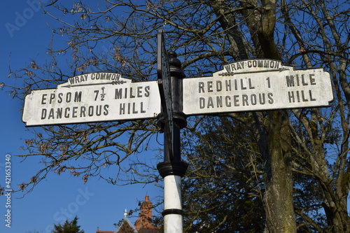Old vintage road sign post in Surrey UK