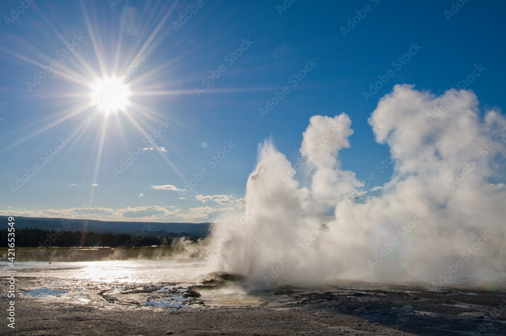 USA, Wyoming, Sun over steaming thermal pool USA, Wyoming, Sun over steaming thermal pool