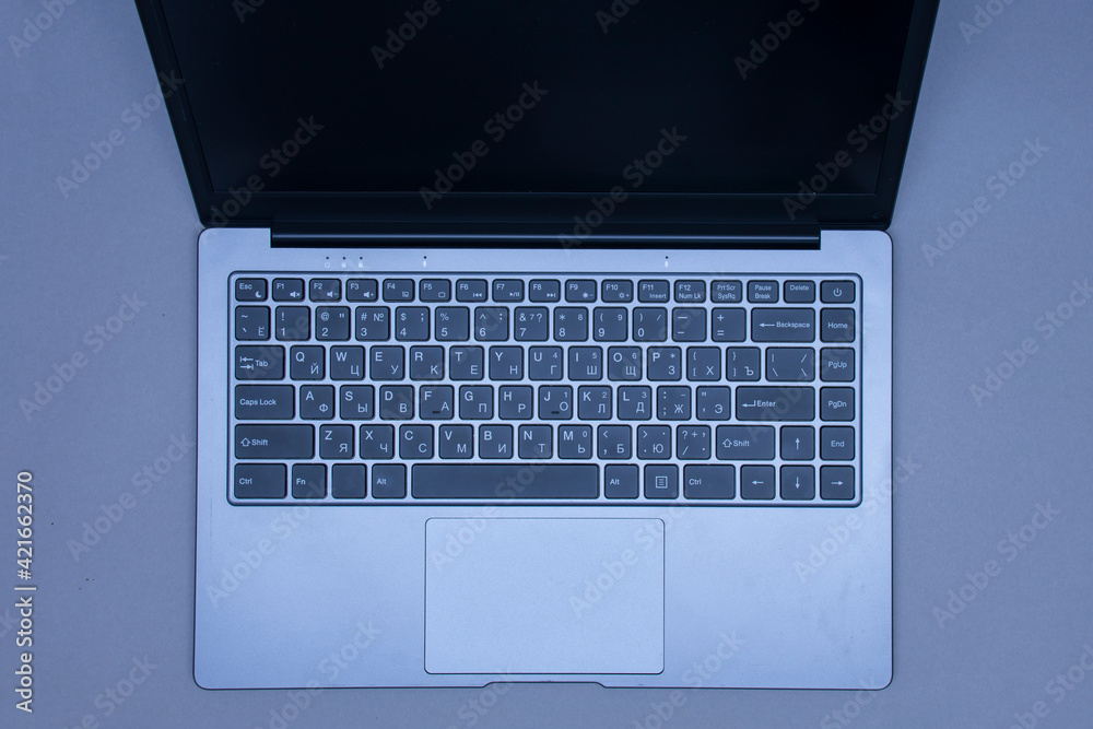 Open laptop on a black background close-up. Open laptop on a black background close-up.