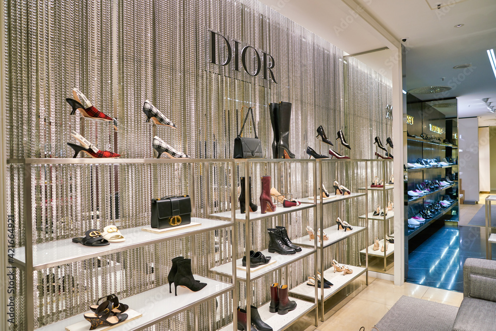 BERLIN, GERMANY - CIRCA SEPTEMBER, 2019: Dior shoes on display at the  Kaufhaus des Westens (KaDeWe) department store in Berlin. Photos | Adobe  Stock