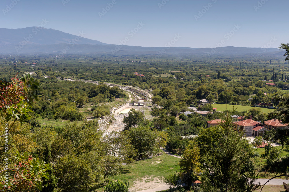 View of Pozar village, mountains and gardens from a height on a sunny, summer day (Central Macedonia, Greece)