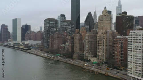 4K Aerial NYC Commuter cars on FDR drive near United Nations overcast cloudy day photo