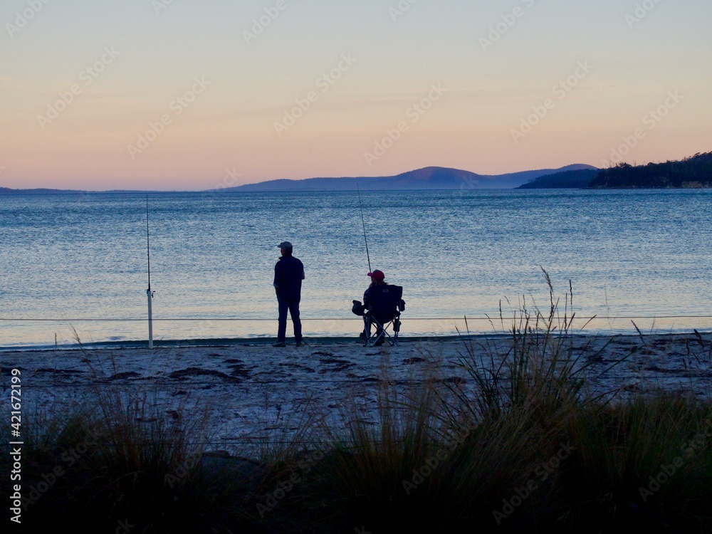Fishermen in sunset