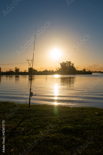 78 / 5000.Resultados de traducción.fishing rod in beautiful river of Argentina at sunset with a beautiful landscape © Horacio